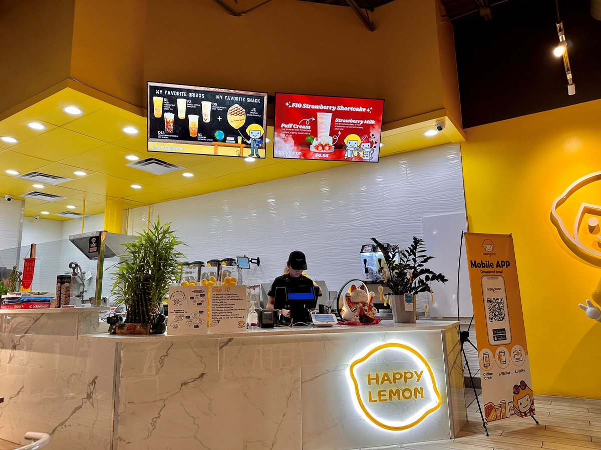 happy lemon ordering counter with yellow walls and bright decor